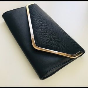 Classic black clutch with gold detailing